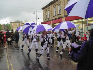 Cry Havoc's Brolly Sidesteps. Dancing in the rain at the Chippenham Folk Festival.