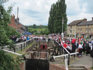 Massed Morris sides by the canal at Stoke Bruerne.