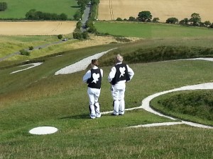 Emma and Mick enjoy the view standing on the White Horse at Uffington.